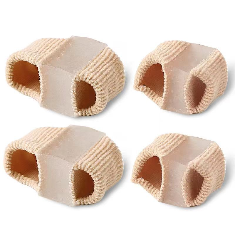 Fiber toe separators in a beige color, featuring a textured surface and open design for comfort.