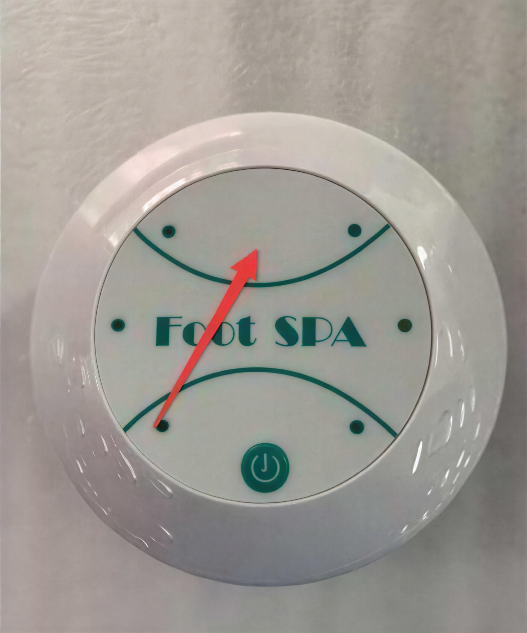 White circular control panel with "Foot SPA" text and red indicator arrow.