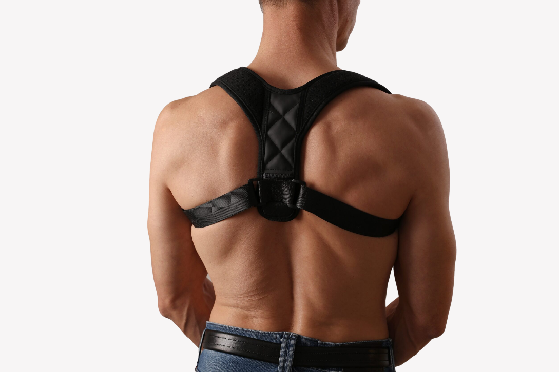 Adjustable posture corrector by My Store worn on back and shoulders to improve posture and spinal alignment.