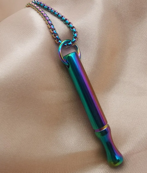 Elegant breathing necklace for anxiety relief, featuring a sleek silver pendant on a delicate chain, designed for calm and mindfulness.