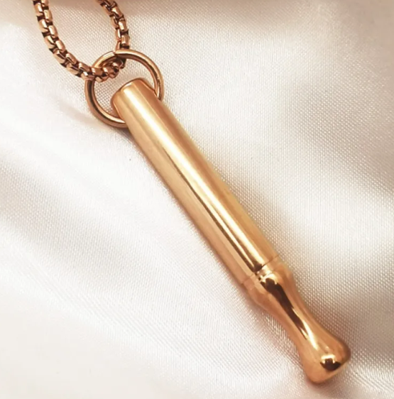 Breathing necklace for anxiety relief featuring a sleek silver pendant on a black cord, designed for calming and mindfulness.